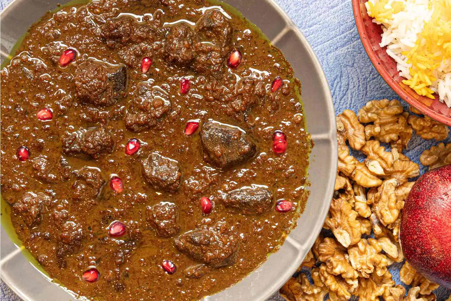 Fesenjan: A traditional stew made with pomegranate and walnut.