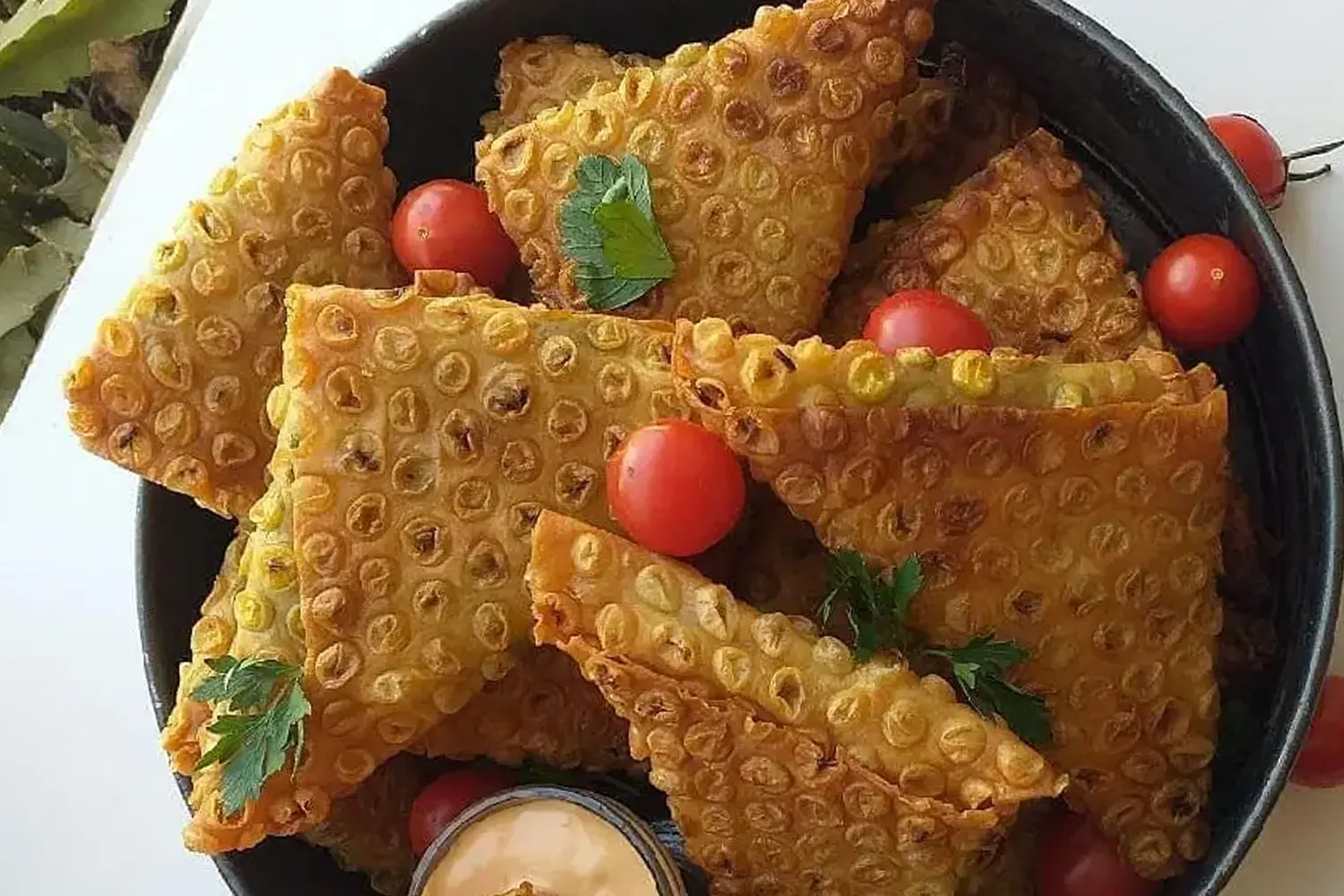 Samboseh – Spicy meat or vegetable samosas.