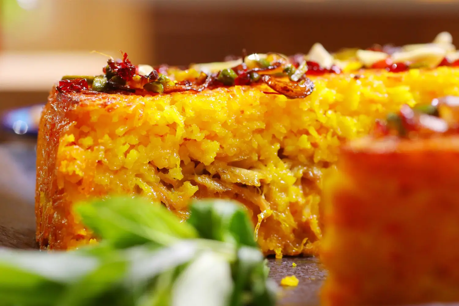 Tahchin: A rice dish with saffron and chicken, baked into a delicious golden crust.
