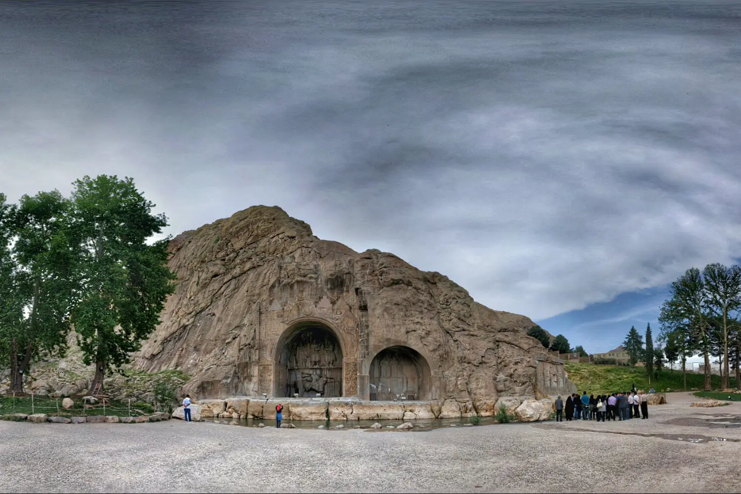 Taq-e Bostan: A stunning collection of Sassanid-era rock carvings depicting royal hunting scenes and the coronation of kings, taking you on a journey through time.